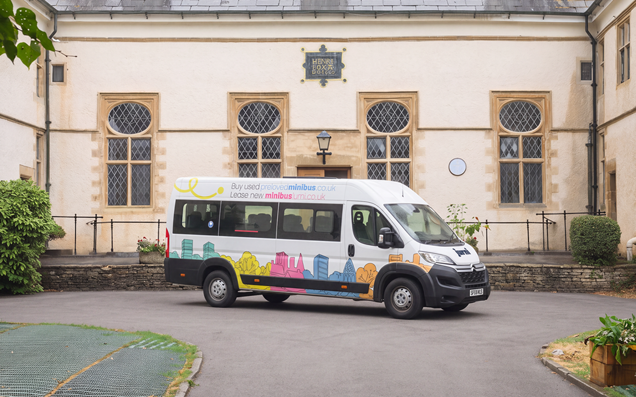 Jurni Leasing minibus outside a college